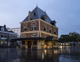 building Waag at dusk in the center of old city leeuwarden in friesland