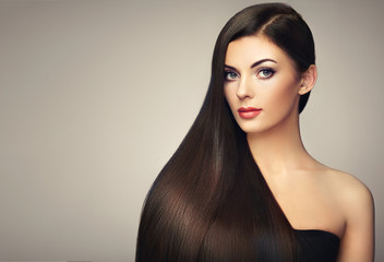 Wall Mural - beautiful woman with long smooth hair. girl with perfect makeup and hairstyle. model brunette with p