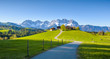© auergraphics - Idyllic alpine scenery, farmhouse in front of snowy mountains, Kitzbühel, Tyrol, Austria