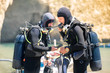 © merla - Scuba divers checking their equipment