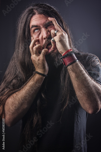 Crazy Metalhead Long Haired Man Shaking His Head And Waving His