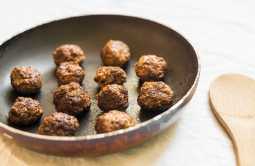 Wall Mural - Cooked meatballs in a frying pan