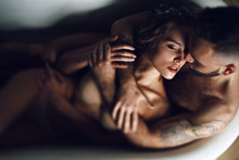 Man Hugs Woman From Behind Lying In The Bath