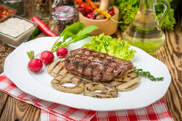 Grilled steak and vegetables on the grill