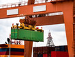 © EKH-Pictures - Industrial crane loading Containers in a Cargo freight ship