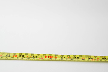 measuring tape on white background with copy space