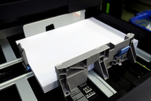Paper Tray For Multifunction Printer In Office With Soft-focus And Over Light In The Background