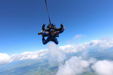 Wall Mural - Tandem skydiving in the blue sky