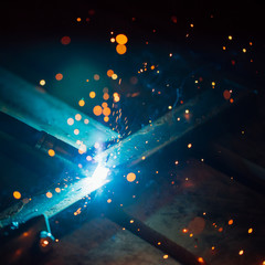 Poster - artistic welding sparks light, industrial background