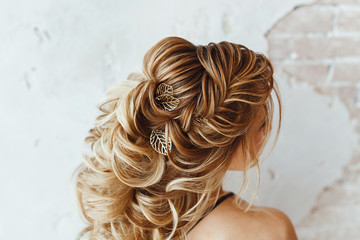 Close up detail of greek braid hairstyle, back rear view at hairdresser salon