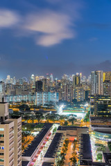 Wall Mural - Public residential condominium building complex at Toa Payoh neighborhood in Singapore, downtown skylines are in background. Aerial view at blue hour.