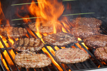 barbecue grill cooking burger steak on the fire