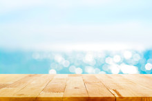 Wood Table Top On Blur Summer Blue Sea And Sky Background
