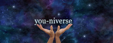 YOU Are EVERYTHING - Hands Reaching Up With The Word YOU-NIVERSE Floating Above Against Dark Blue Night Sky Background With Plenty Of Copy Space