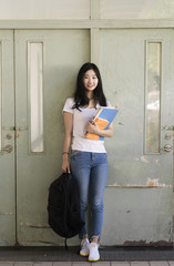 Wall Mural - female asian college student on campus