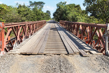 Old Steel And Wooden Bailey Bridge Crossing Over In The Rural Countryside.
