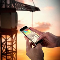 Poster - Composite 3d image of close-up of man holding smart phone