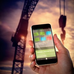 Poster - Composite 3d image of close-up of hand holding mobile