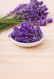 Fototapeta Lawenda - lavender blossoms / Porcelain bowl with lavender blossoms and bouquet with lavender 