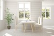 © AntonSh - White dinner room with green landscape in window. Scandinavian interior design. 3D illustration