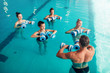 © Nomad_Soul - Women aqua aerobics traninig with dumbbells