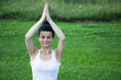 © Novak - Young girl doing yoga in the Park