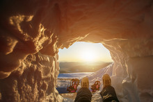 Snowboarder Foot, Having Rest In Snow Cave On The Top Of Mountain With Sunrise View
