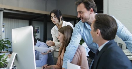Poster - Business People Join Colleagues Working On Computer In Discussion Of New Strategy For Startup, Team Analyzing Documents In Modern Office Space Slow Motion 60