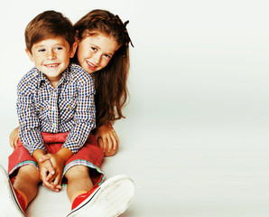 little cute boy and girl hugging playing on white background, ha