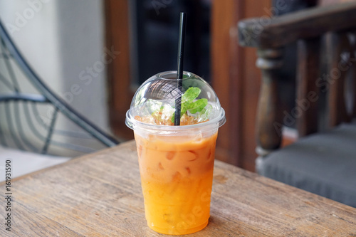 iced ceylon tea with lemon and orange in plastic glass on wooden table and blurred background summer cocktail or tropical mocktail buy this stock photo and explore similar images at adobe iced ceylon tea with lemon and orange