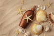 suntan lotion and seashells on the sand beach