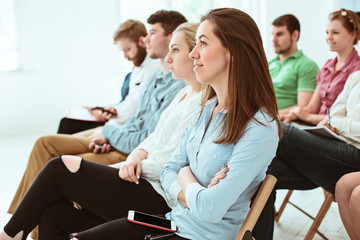 the people at business meeting in the conference hall.