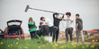 © guruXOX - Behind the scene. Film crew filming movie scene outdoor