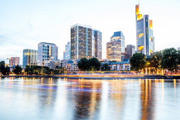 Wall Mural - Beautiful cityscape view on the illuminated skyscrapers during the twilight in Frankfurt, Germany