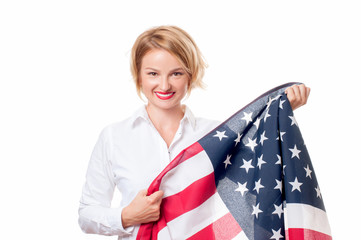 Smiling patriotic woman holding United States flag. USA celebrate 4th July.