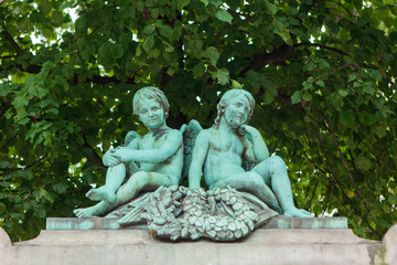 Bronze statue of two cupids sitting