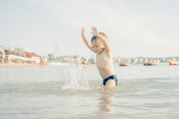 Little boy swimming in sea