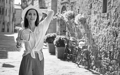 BW photography of a beautiful tourist woman. Italian holiday concept