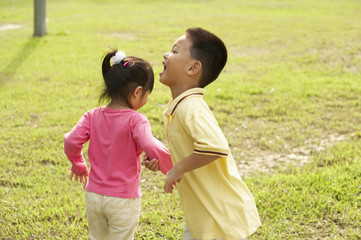 boy and girl playing at the park