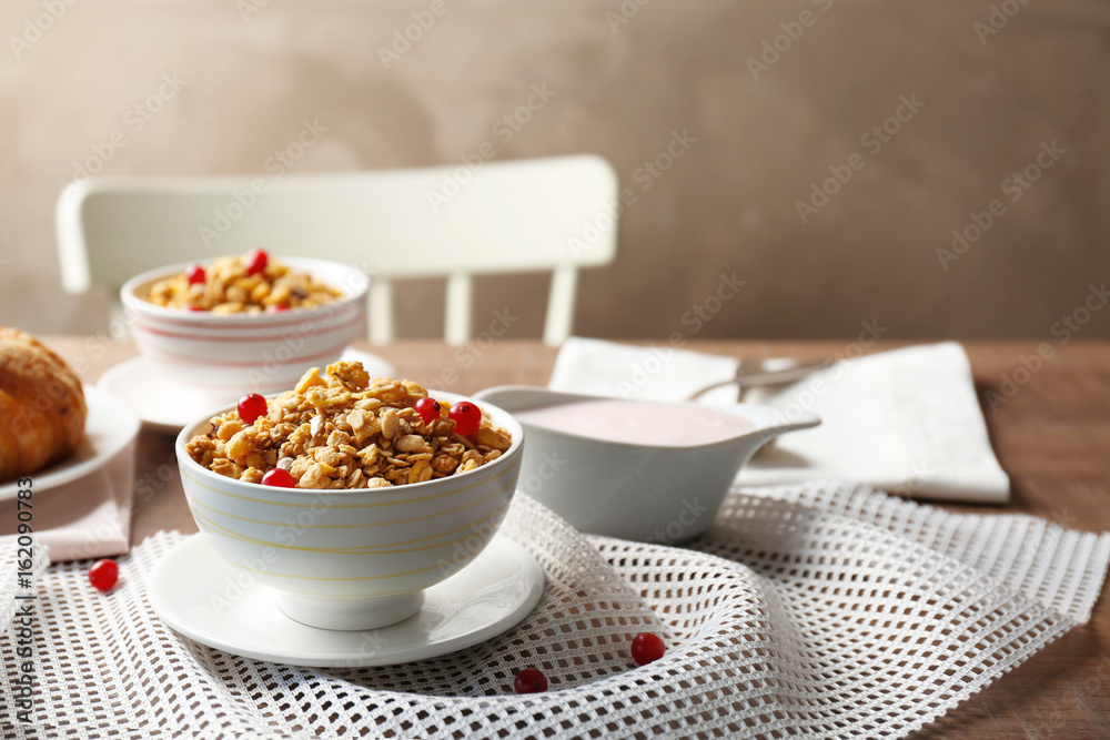 Breakfast cereal with cranberries and sunflower seeds on table