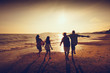 © Patrick Foto - Asian family running on background of sunset beach and sea