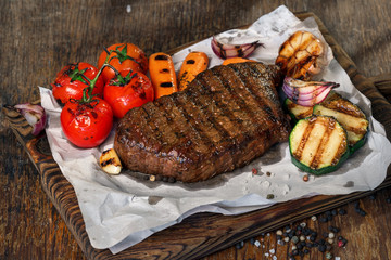 Poster - Beef grilled steak with set of grilled vegetables close up