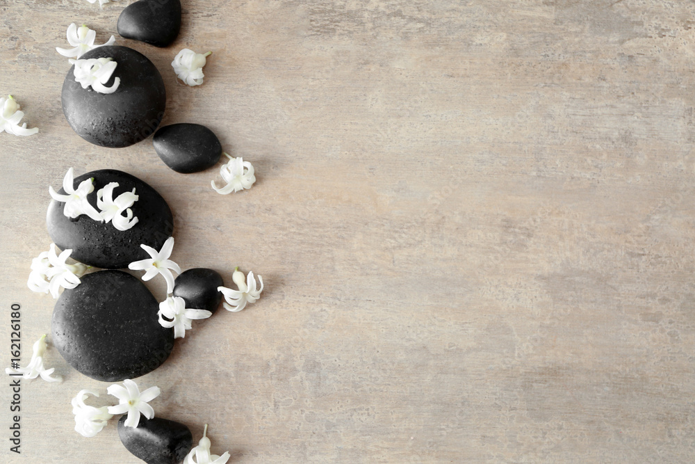 Spa stones and hyacinth on textured background