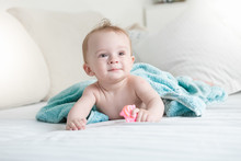 9 Months Old Baby On Bed Under Blue Towel After Having Shower
