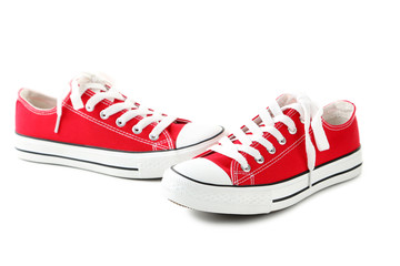 Wall Mural - Pair of red sneakers isolated on a white