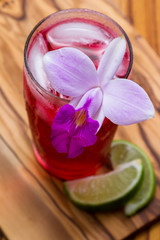 Poster - tropical cocktail a wooden table