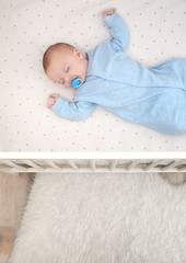 Poster - Cute little baby sleeping in cradle at home