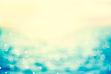 Wall Mural - retro color tone of blur beautiful shiny sparkling tropical blue sea beach , the fresh summer backgr