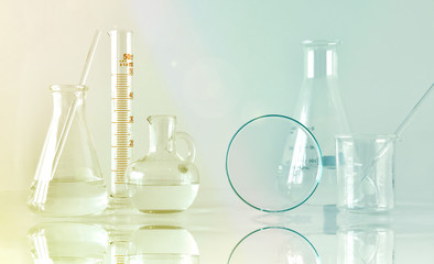 Group of scientific laboratory glassware with clear liquid solution, Research and development concept.