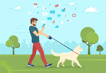 man walking with dog outdoors in park and using smartphone to read news and messages in social netwo